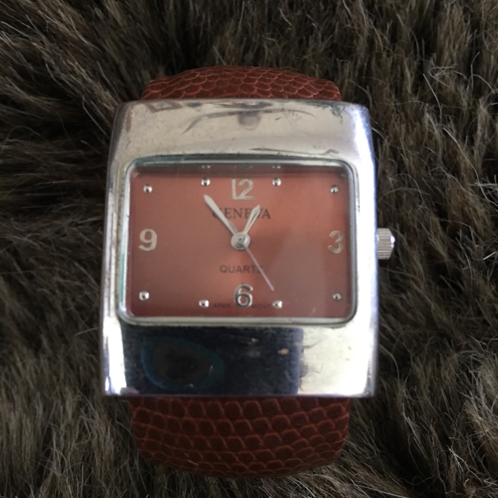 Ladies Geneva brown faux snake clamp watch